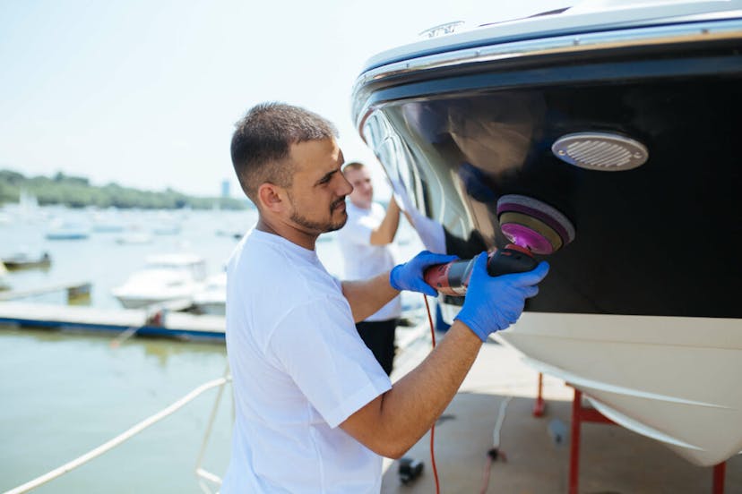 Male polishing a boat
