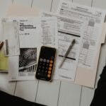 Calculator and financial statements laid out on a table
