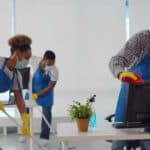 Cleaning service crew members cleaning an office space