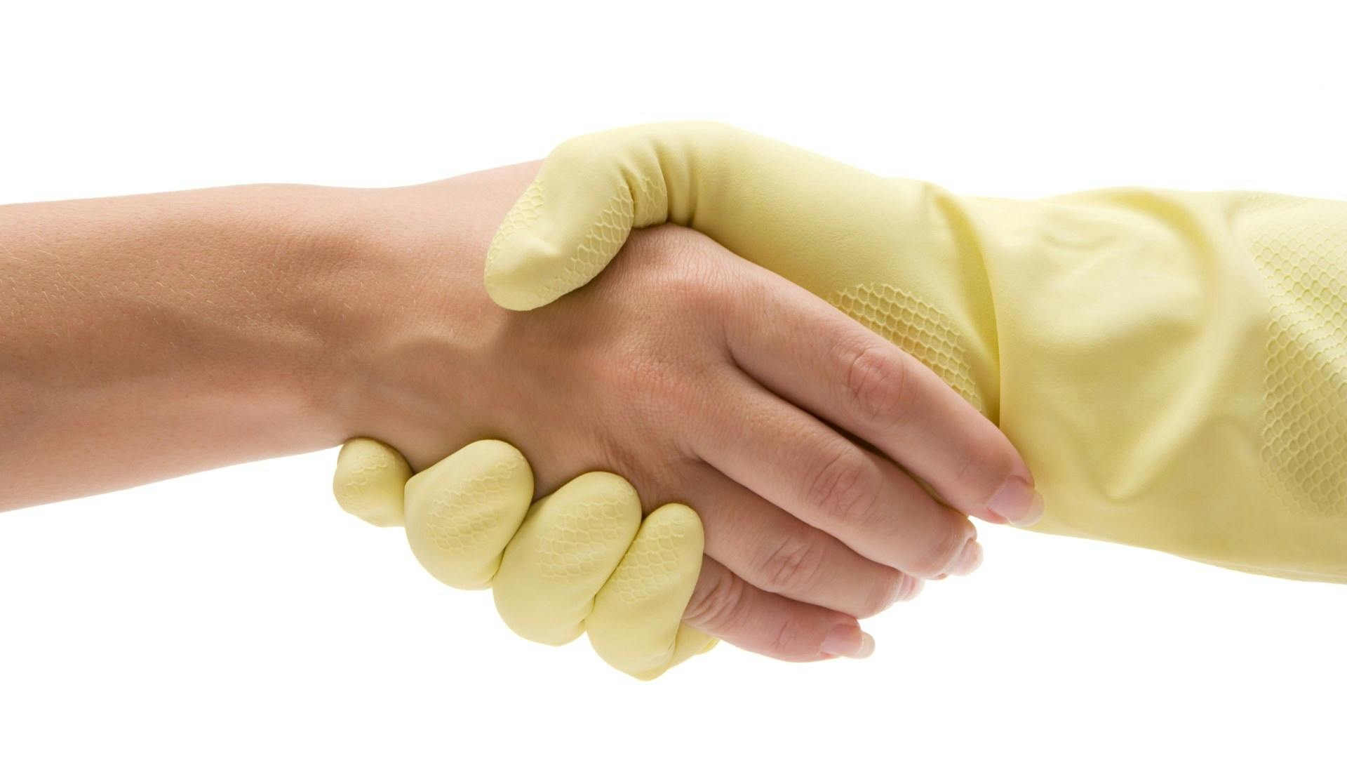 Cleaner shaking hand with client