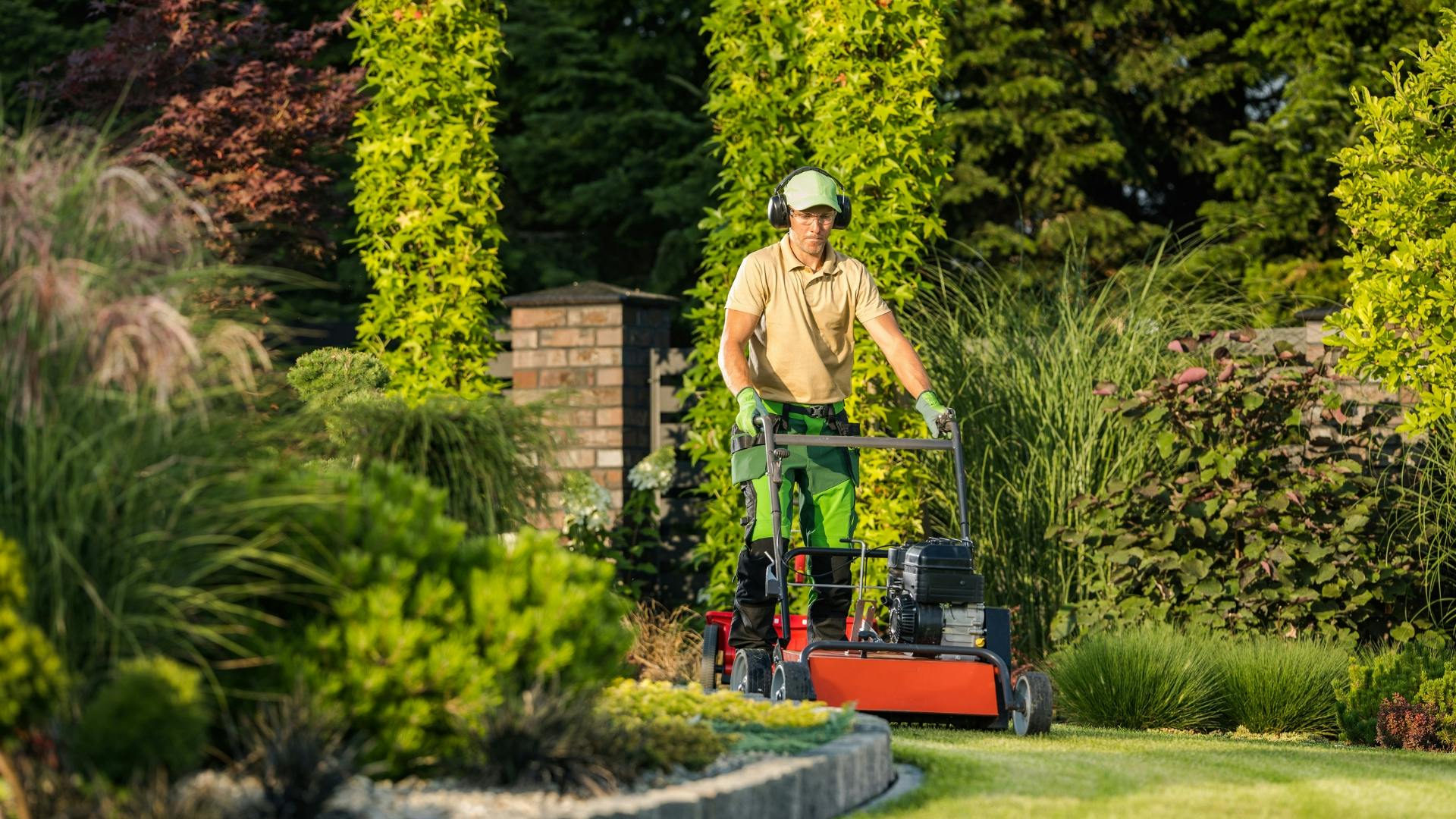 lawn care business owner on a lawn mower